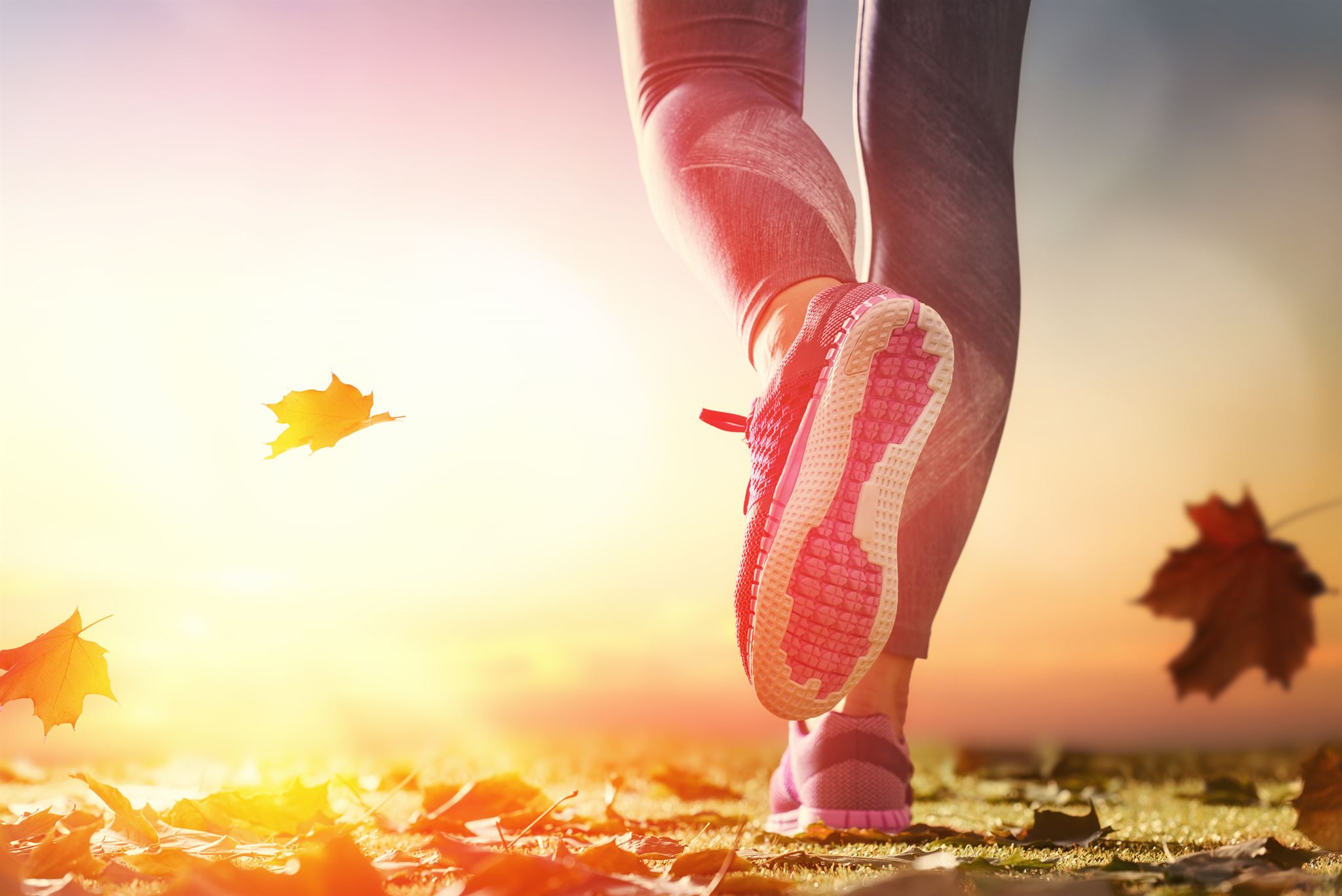 Person-running-across-leaf-littered-surface